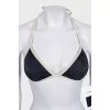 Black swimsuit with branded logo and tag