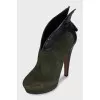 Green high-heeled ankle boots