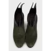 Green high-heeled ankle boots
