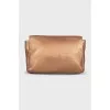 Gold-colored leather cosmetic bag