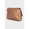 Gold-colored leather cosmetic bag