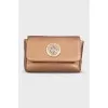 Gold-colored leather cosmetic bag