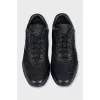 Black sneakers with a brand logo