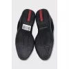 Black sneakers with a brand logo
