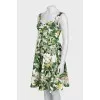 Fitted sundress with a green print
