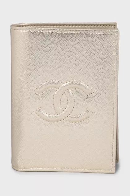 Gold-tone wallet with signature embossing