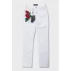 Low-waist jeans decorated with embroidery