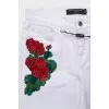 Low-waist jeans decorated with embroidery