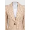 Beige tweed suit with a checkered print skirt