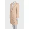 Beige tweed suit with a checkered print skirt