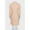Beige tweed suit with a checkered print skirt