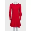 Red dress decorated with gold buttons