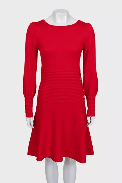 Red dress decorated with gold buttons