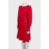 Red dress decorated with gold buttons