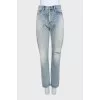 Light blue ripped jeans with distressing