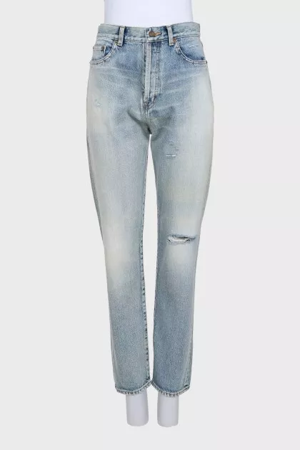Light blue ripped jeans with distressing