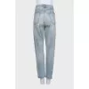 Light blue ripped jeans with distressing