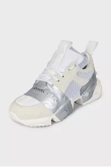 Beige sneakers with a signature logo