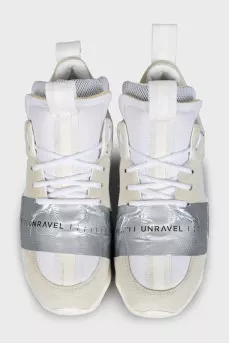 Beige sneakers with a signature logo