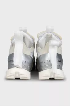 Beige sneakers with a signature logo