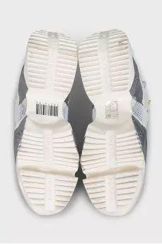 Beige sneakers with a signature logo
