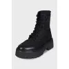 Black boots with leather inserts