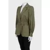 Green fitted jacket with a button