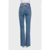 Blue jeans with zippered pockets