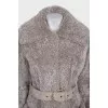 Fitted fur coat with a belt