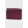 Leather wallet with a button and a brand logo