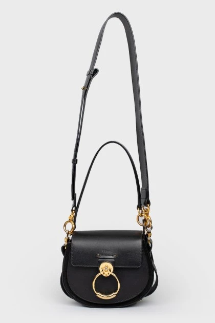 A handbag with a long Tess handle