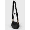 A handbag with a long Tess handle