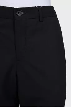 Black wool trousers with a zipper and buttons