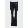 Black flared jeans with gold hardware