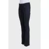 Black flared jeans with gold hardware