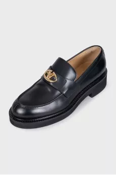 Black loafers with gold hardware