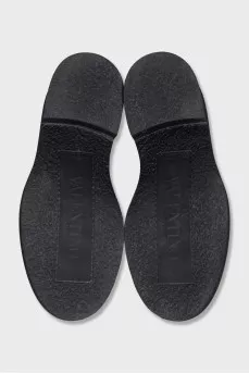 Black loafers with gold hardware