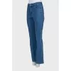 Blue boot cut fit jeans with embroidered pockets