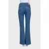 Blue boot cut fit jeans with embroidered pockets