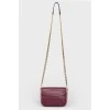 Handbag with a long chain handle