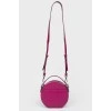 Round handbag on a long strap