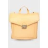 Rectangular leather backpack with tag