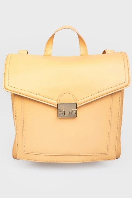 Rectangular leather backpack with tag