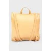 Rectangular leather backpack with tag