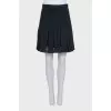 Black pleated skirt with tag