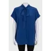 Sleeveless silk blouse with buttons