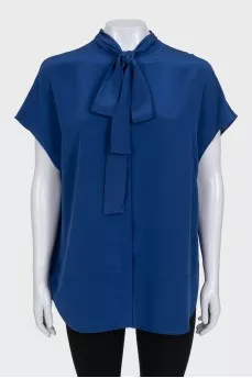Sleeveless silk blouse with buttons
