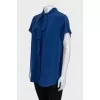 Sleeveless silk blouse with buttons