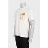 Men's yellow t-shirt with branded design