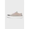 Suede sneakers with a decorated toe